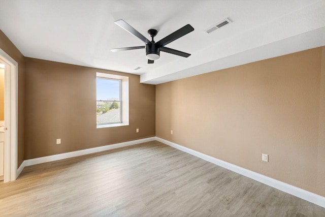 spare room with ceiling fan and light hardwood / wood-style floors