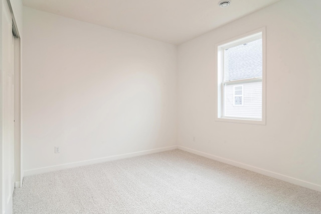 unfurnished room with carpet flooring