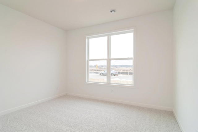 spare room featuring carpet floors