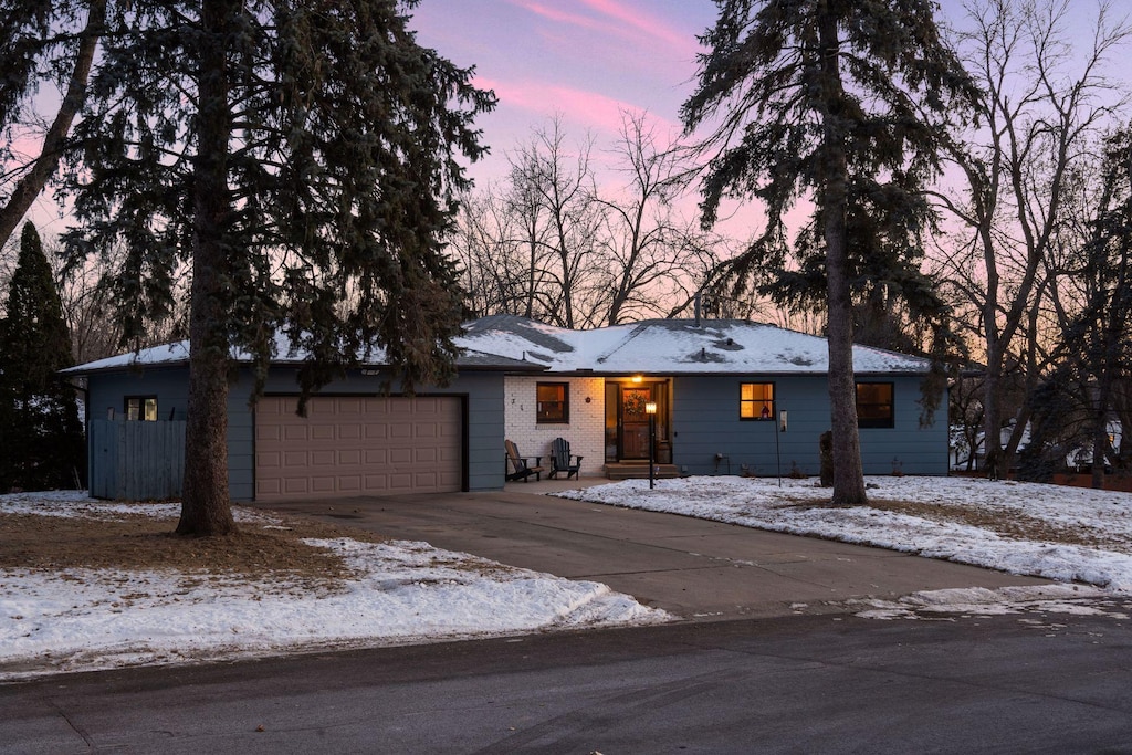 single story home featuring a garage