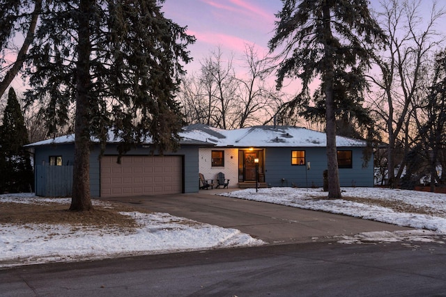 single story home featuring a garage