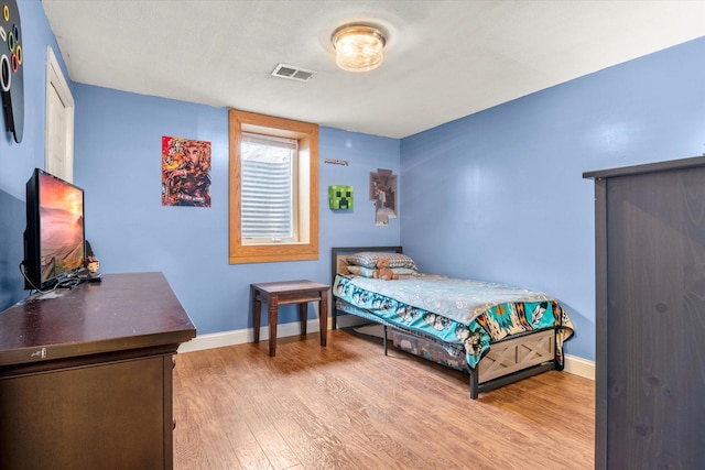 bedroom with light wood-type flooring