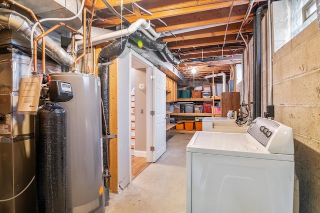 basement featuring washer / dryer and gas water heater