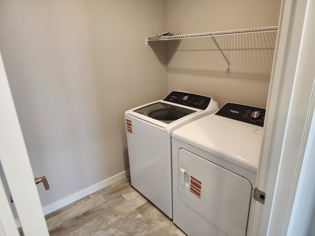 clothes washing area featuring washer and dryer