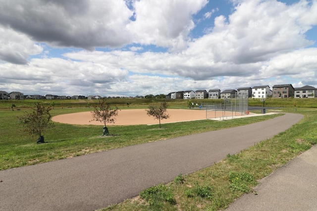 view of home's community with a lawn