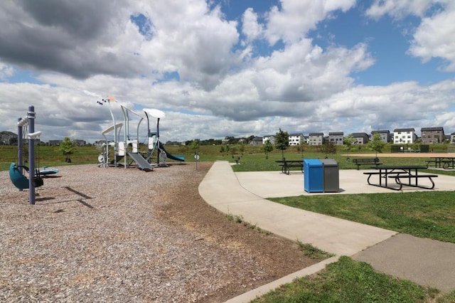 view of playground with a lawn