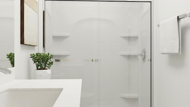 bathroom featuring walk in shower and vanity