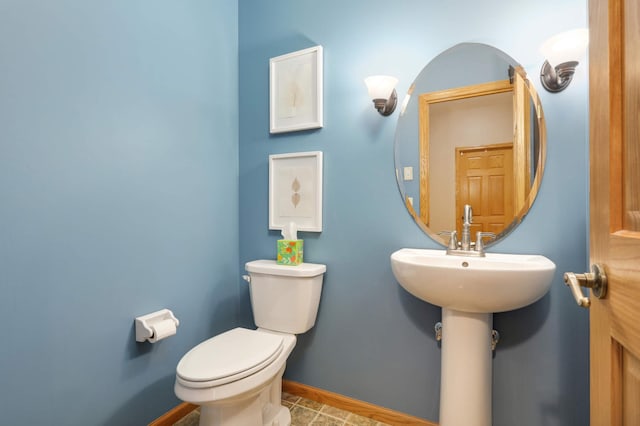 bathroom featuring tile patterned floors and toilet