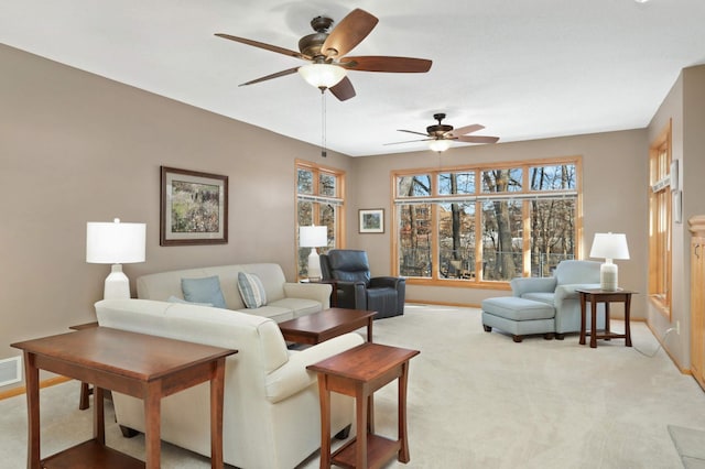 living room with ceiling fan and light colored carpet