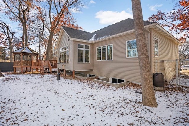 snow covered property featuring a gazebo