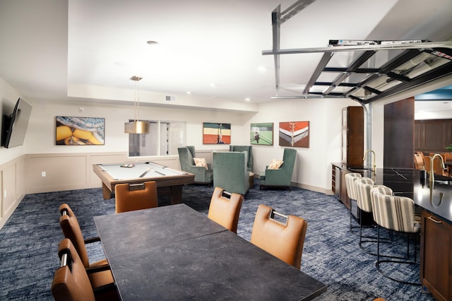 carpeted dining space featuring sink and billiards