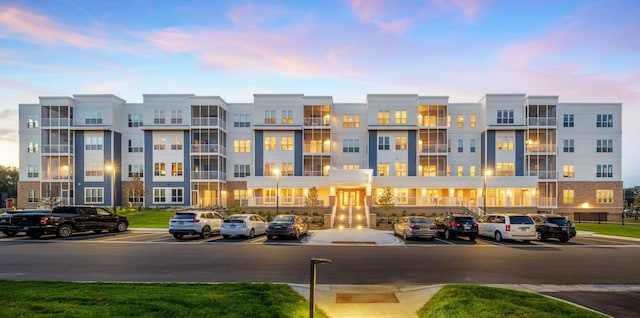 view of outdoor building at dusk