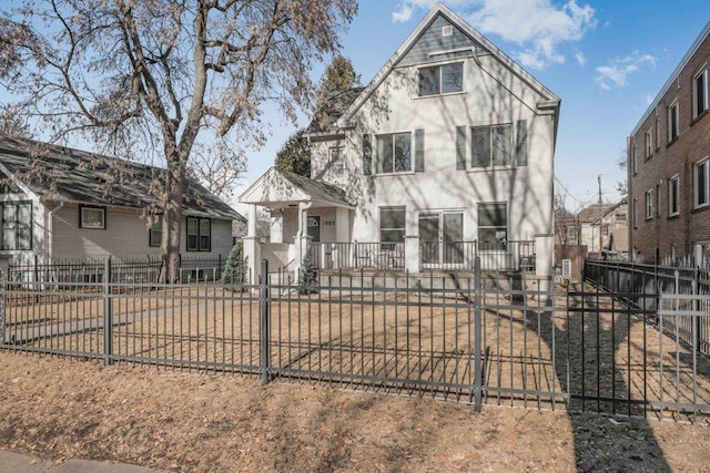 view of front of house with a fenced front yard and stucco siding