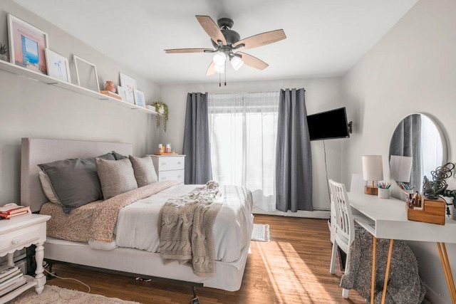 bedroom with ceiling fan and wood finished floors