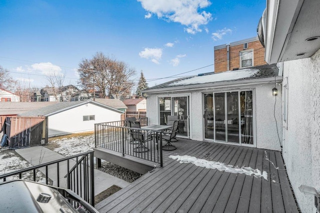 wooden deck featuring outdoor dining area