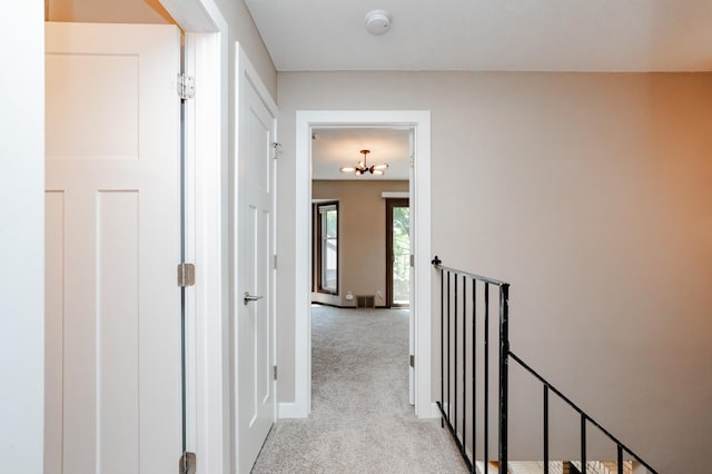 corridor with light carpet