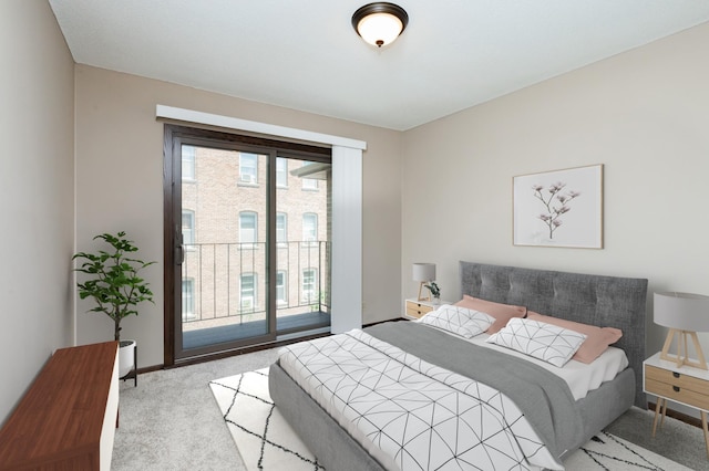 bedroom featuring access to exterior and light colored carpet