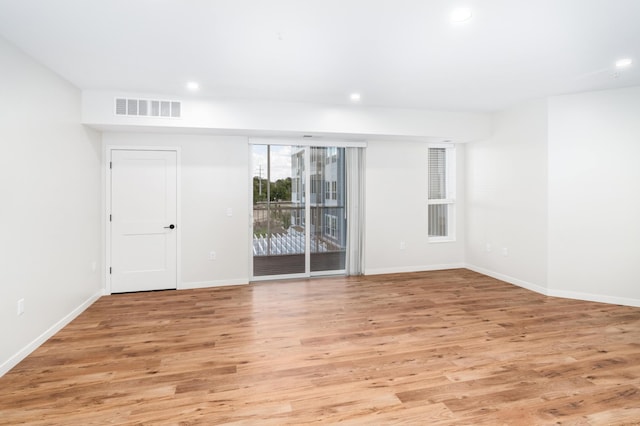 unfurnished room featuring light wood-type flooring