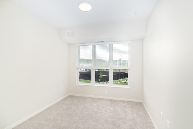 empty room featuring light colored carpet