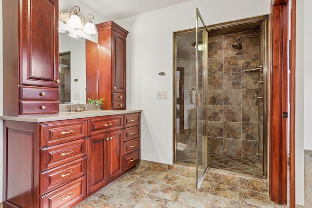 bathroom with vanity and a shower with shower door