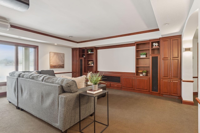 home theater with crown molding, carpet flooring, and built in shelves