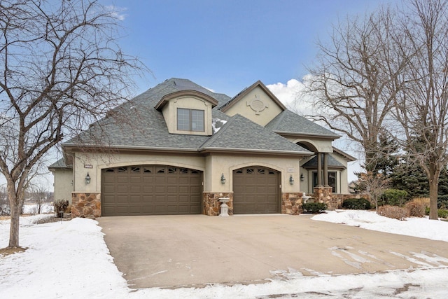 french provincial home featuring a garage