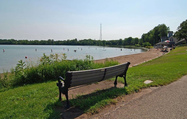 surrounding community with a water view