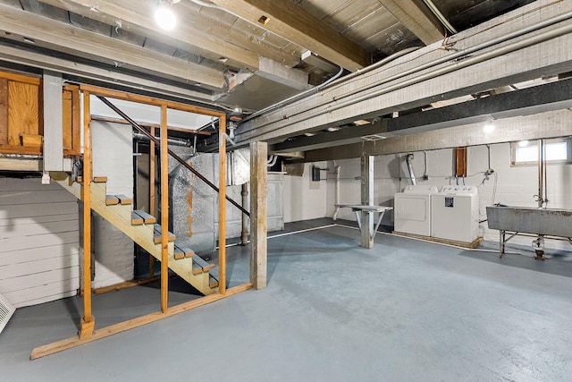 basement featuring sink and washer and clothes dryer