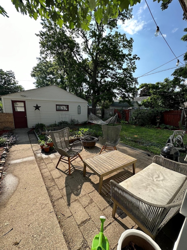 view of patio / terrace featuring an outdoor fire pit