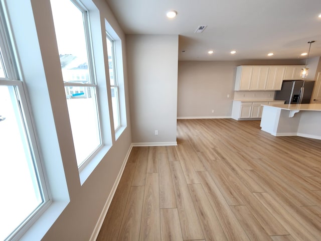 interior space with plenty of natural light and light wood-type flooring