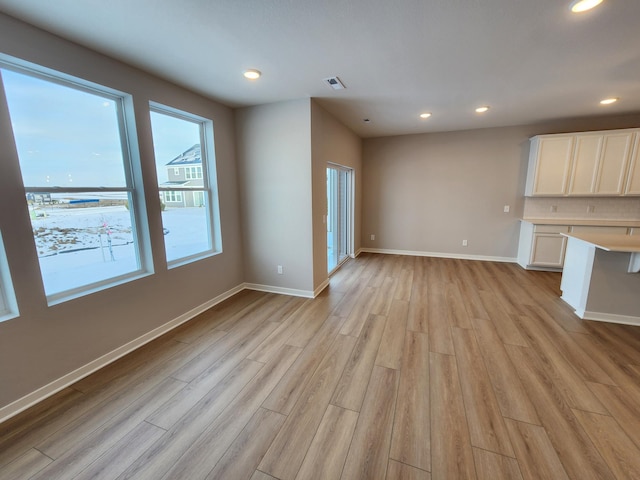 unfurnished living room featuring light hardwood / wood-style floors