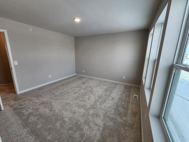 view of carpeted spare room