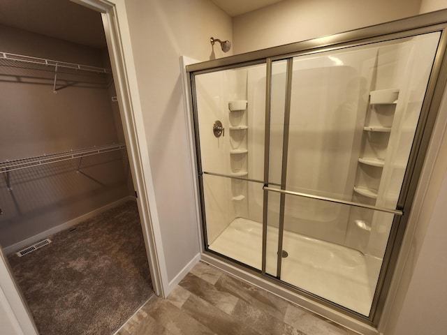 bathroom with an enclosed shower