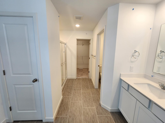 bathroom featuring vanity and walk in shower