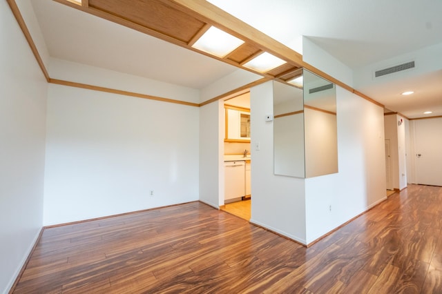 unfurnished room with dark hardwood / wood-style floors