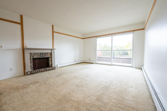 unfurnished living room featuring carpet, a baseboard heating unit, and a fireplace