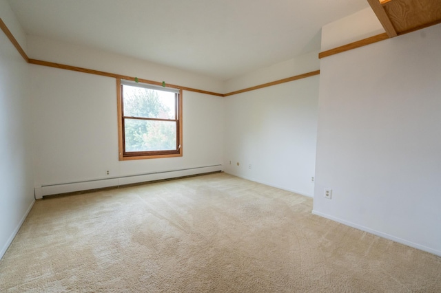 carpeted empty room featuring baseboard heating