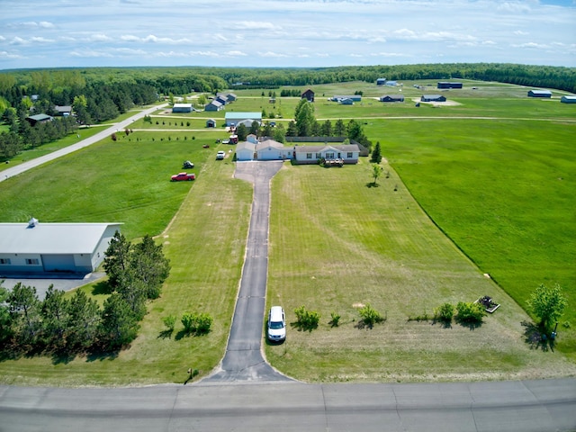 birds eye view of property featuring a rural view