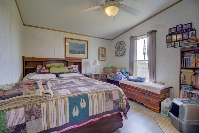 bedroom featuring ceiling fan, vaulted ceiling, ornamental molding, and light hardwood / wood-style floors