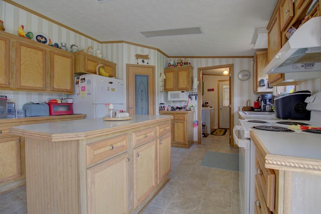 kitchen featuring a textured ceiling, white appliances, a kitchen island, light brown cabinets, and ornamental molding