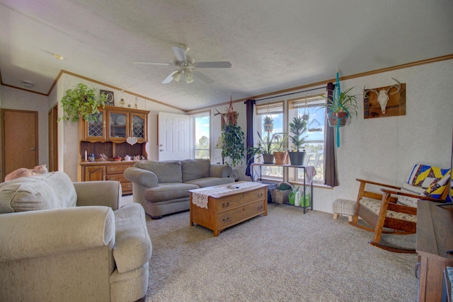 carpeted living room with vaulted ceiling, ceiling fan, ornamental molding, and a textured ceiling