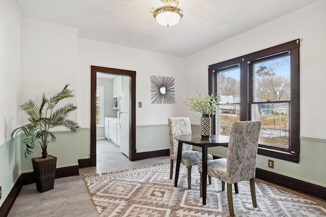 dining area with a textured ceiling