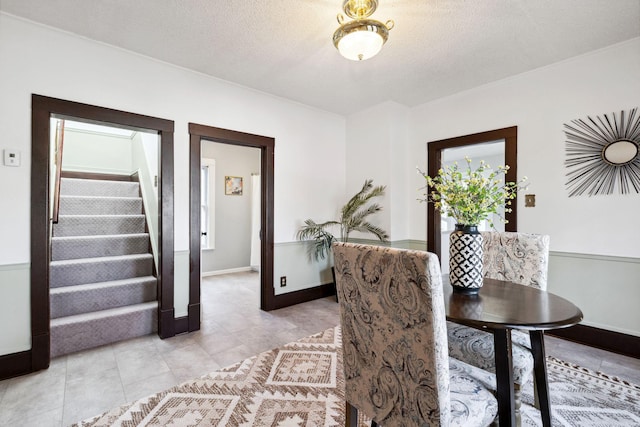 dining space with a textured ceiling