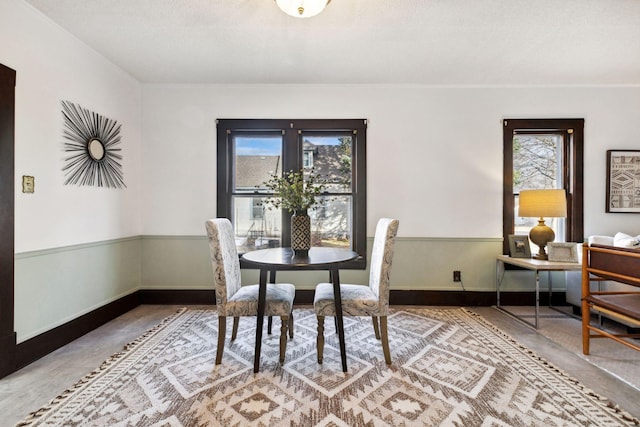 dining space featuring a wealth of natural light and a textured ceiling