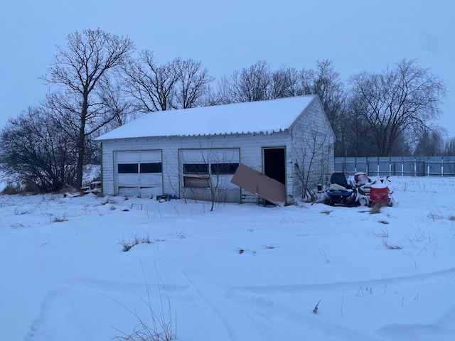 view of snow covered garage