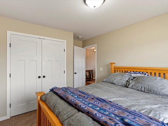 carpeted bedroom featuring a closet