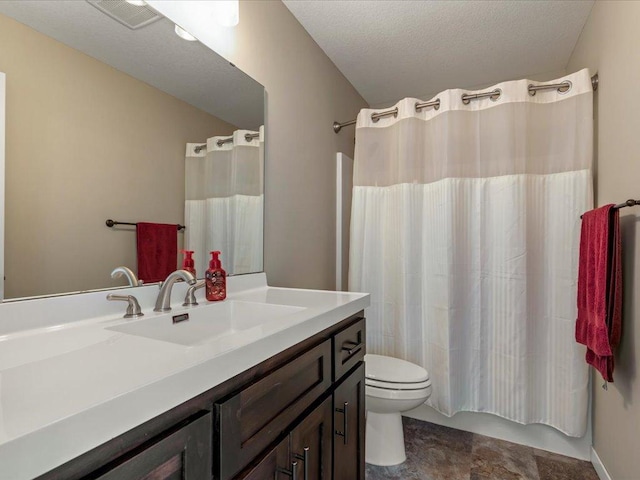 bathroom featuring toilet, vanity, a textured ceiling, and shower / bathtub combination with curtain