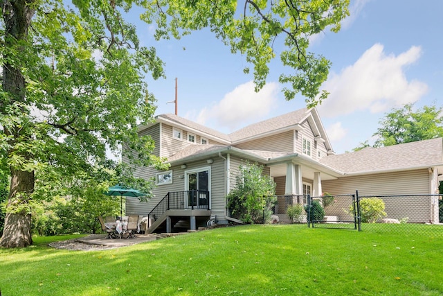 back of property featuring a yard and a patio area