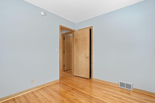 unfurnished room featuring hardwood / wood-style floors