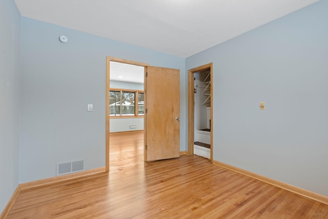 spare room with light hardwood / wood-style floors